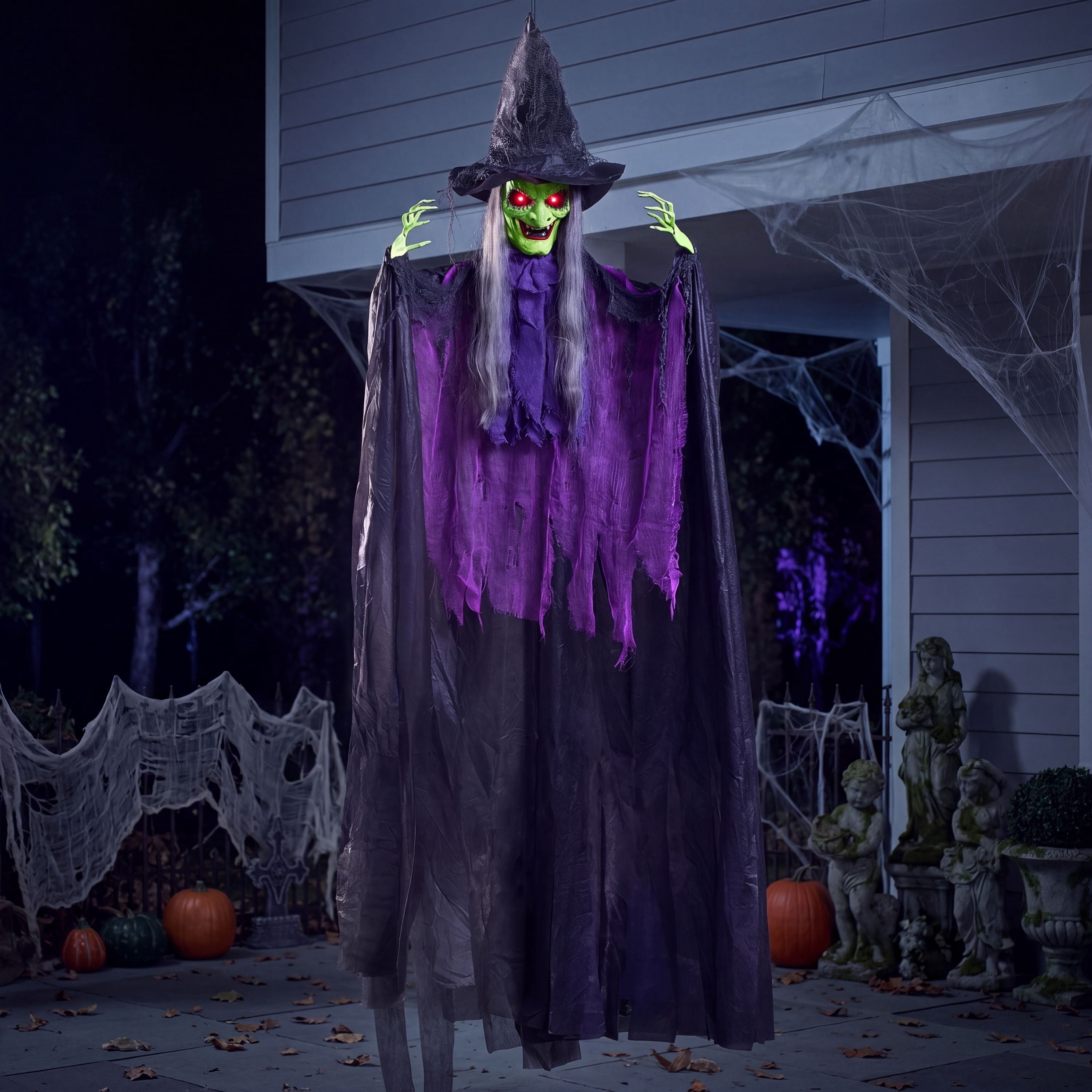 72-inch sound-activated hanging witch with glowing eyes for a Halloween porch display