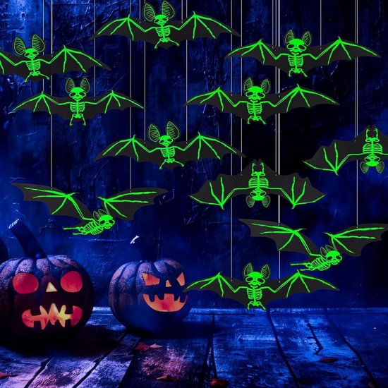 Glowing skeleton bat decorations arranged in a dark Halloween scene