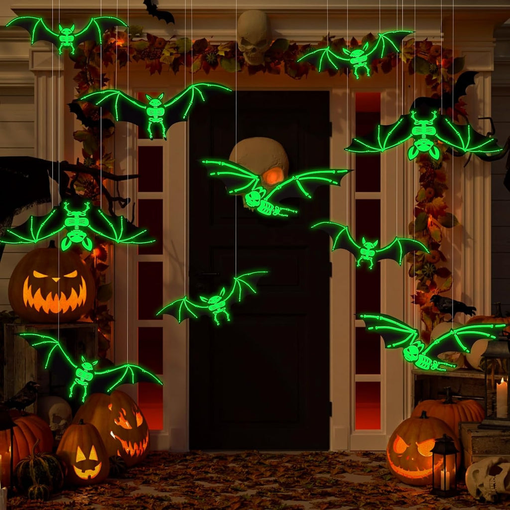12-piece glowing skeleton bat swarm hanging across a Halloween porch